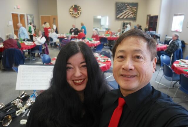 Playing handbells at a Christmas luncheon party in Holland, Michigan