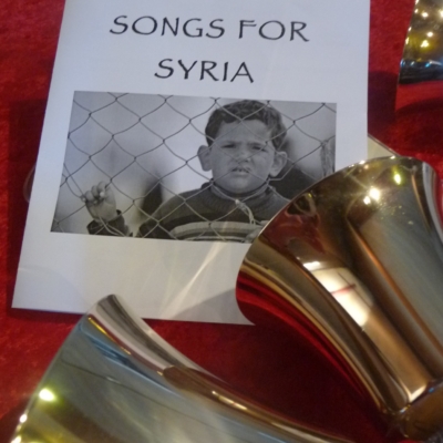 Handbell duo Larry and Carla at the Songs for Syria concert program