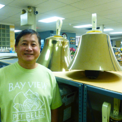 Larry Sue with bass handbells at the Malmark Bellcraftsmen factory
