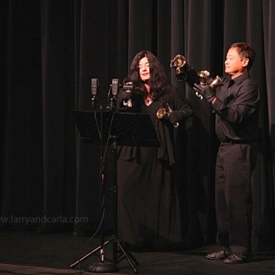 Handbell duo Larry and Carla perform on stage at Los Altos Live, 2014