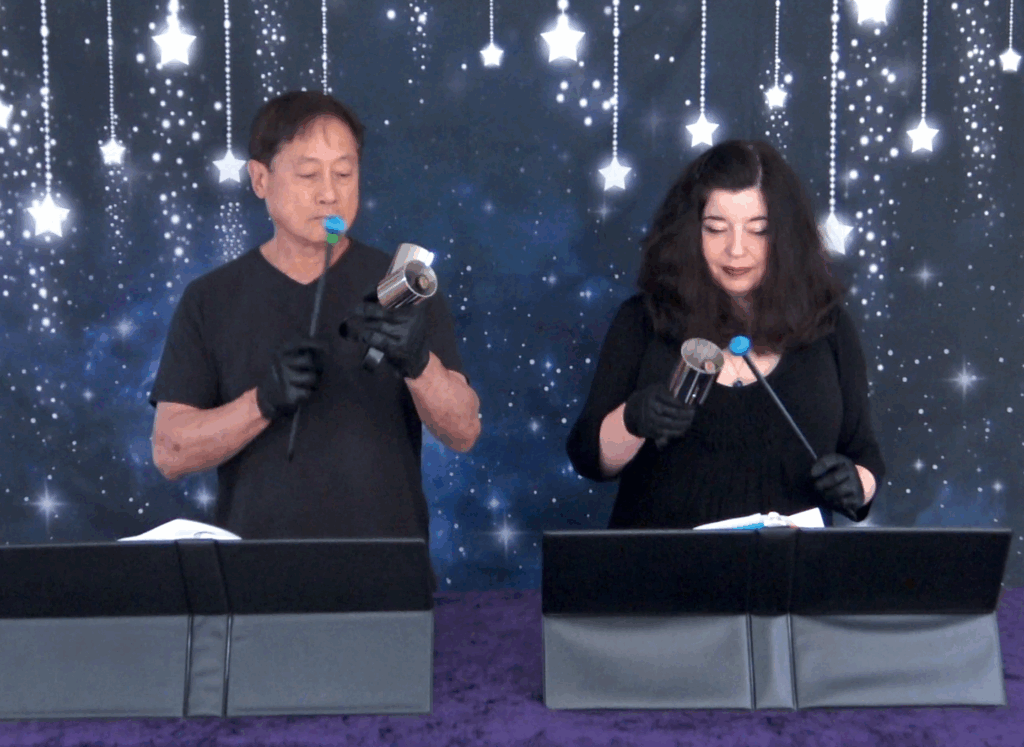 two handbell ringers with Schulmerich Silver Melody Bells